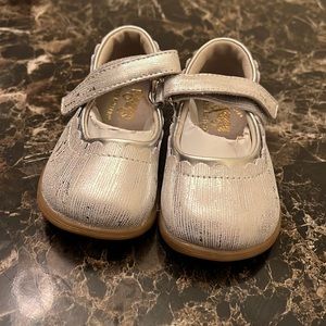 Shoes that she just grew out of && are taking you space